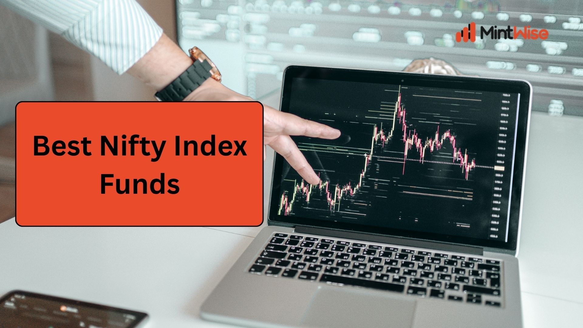 Person analyzing stock market charts on a laptop representing the best Nifty index funds for long-term investing and passive wealth creation.