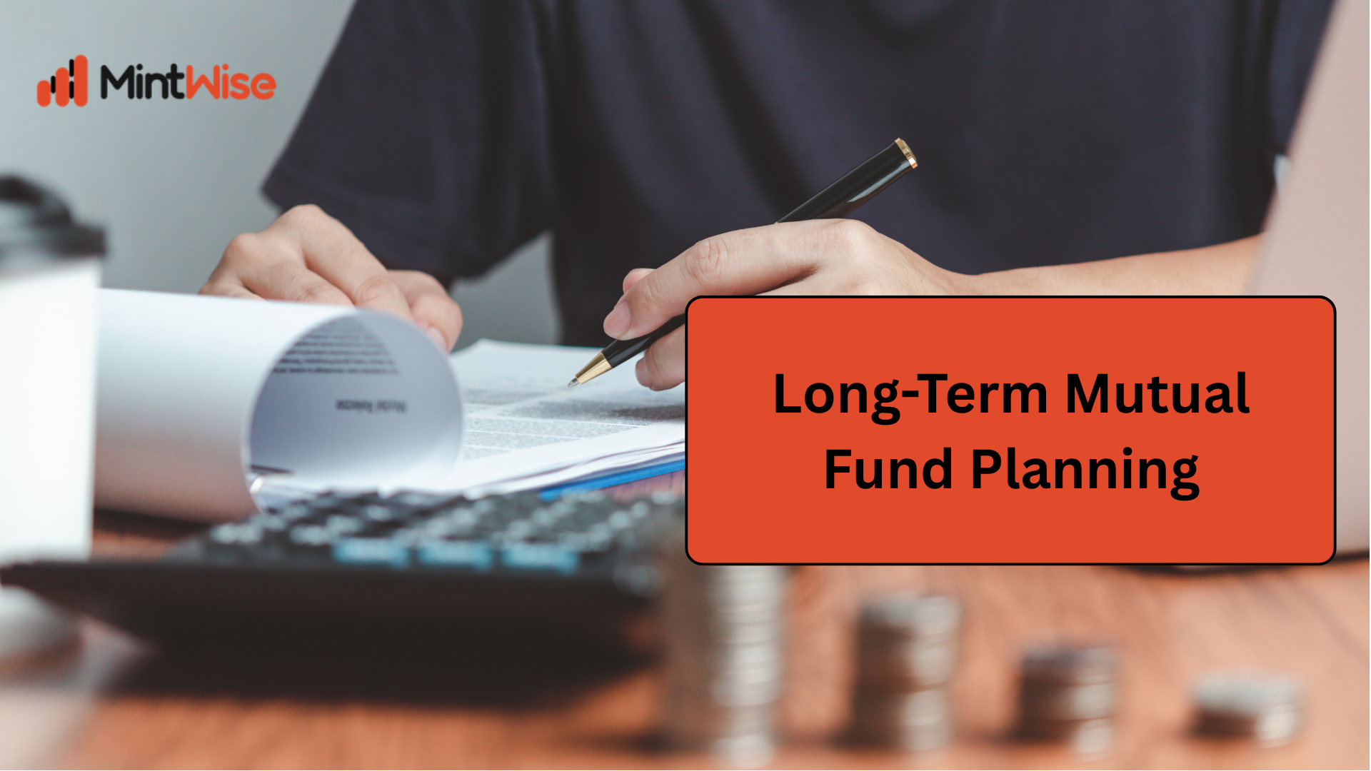 Financial advisors reviewing investment planning reports and budget charts to create a goal-based investment strategy for long-term wealth creation.
