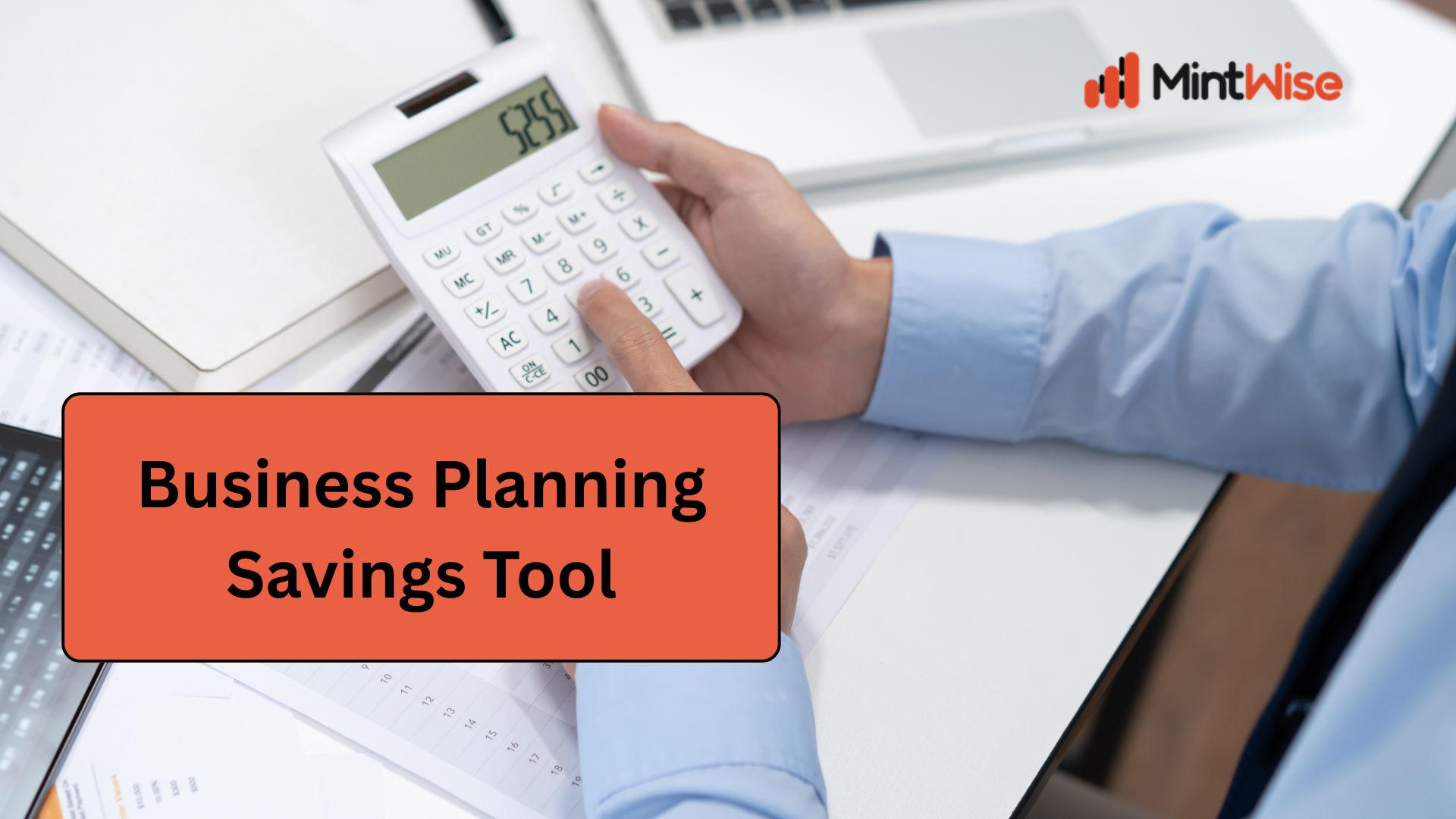 MintWise Business Planning Savings Tool showing a professional using a calculator, financial documents, and a laptop to estimate business savings, budget planning, and financial forecasting.