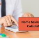 Home Saving Goal planning concept showing a person using a calculator beside a model house to plan and save for a future home.