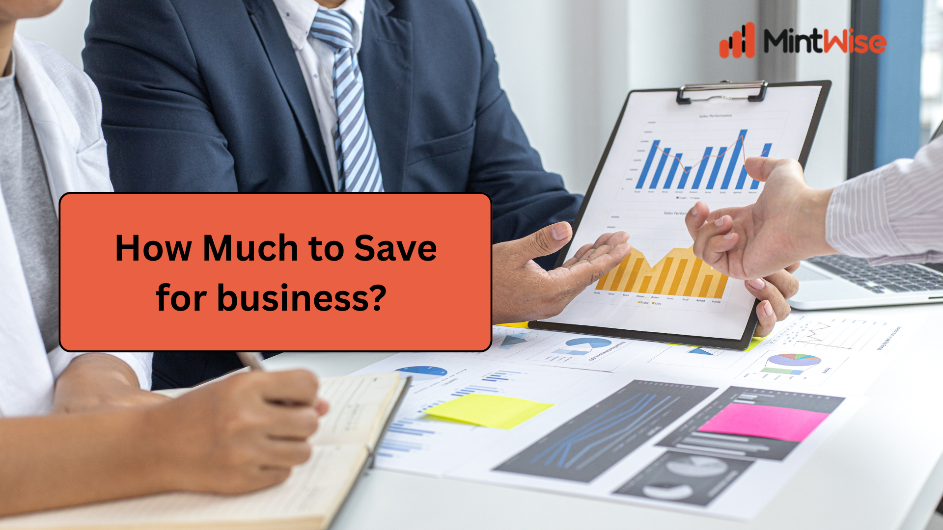 MintWise business savings guide showing professionals reviewing financial reports, charts, and business performance data to calculate how much to save for starting or growing a business.