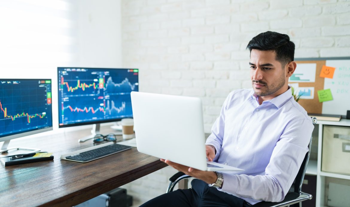 Compare Mutual Funds in India – Investor analyzing mutual fund performance, returns, and market trends on a laptop with financial charts.