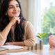 Mutual fund investment planning in India with a woman reviewing financial goals and savings.