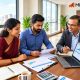 Mutual fund planning Services with a financial advisor and clients, featuring the MintWise logo.